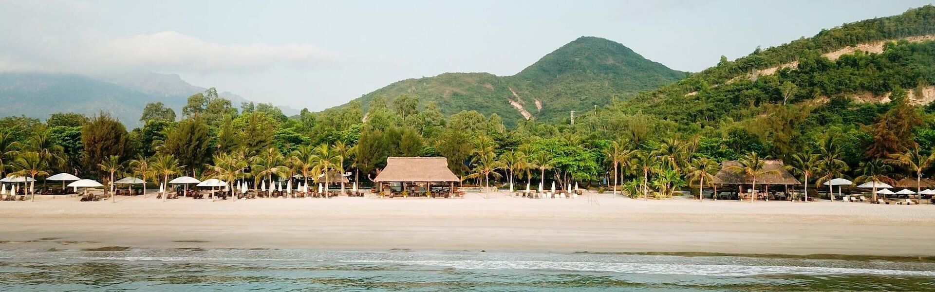 Nha Trang’s vibrant coastline in Vietnam on a Nha Trang Travel banner by Legend Travel Group.